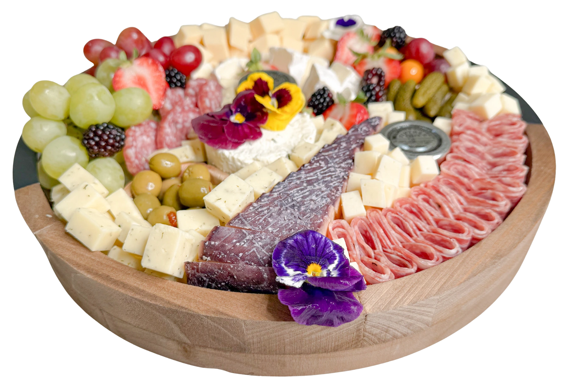 side view of a small charcuterie board by Fork and Flare in Orange County featuring borsin cheese, brie cheese, white cheddar cheese, gouda cheese, bellavitano cheese, assorted cured meats and salami, fresh grapes, strawberries, blackberries, gooseberries, olives, cornichons, honey, and jam arranged in an artisan, gourmet presentation showcasing the best charcuterie in Orange County.