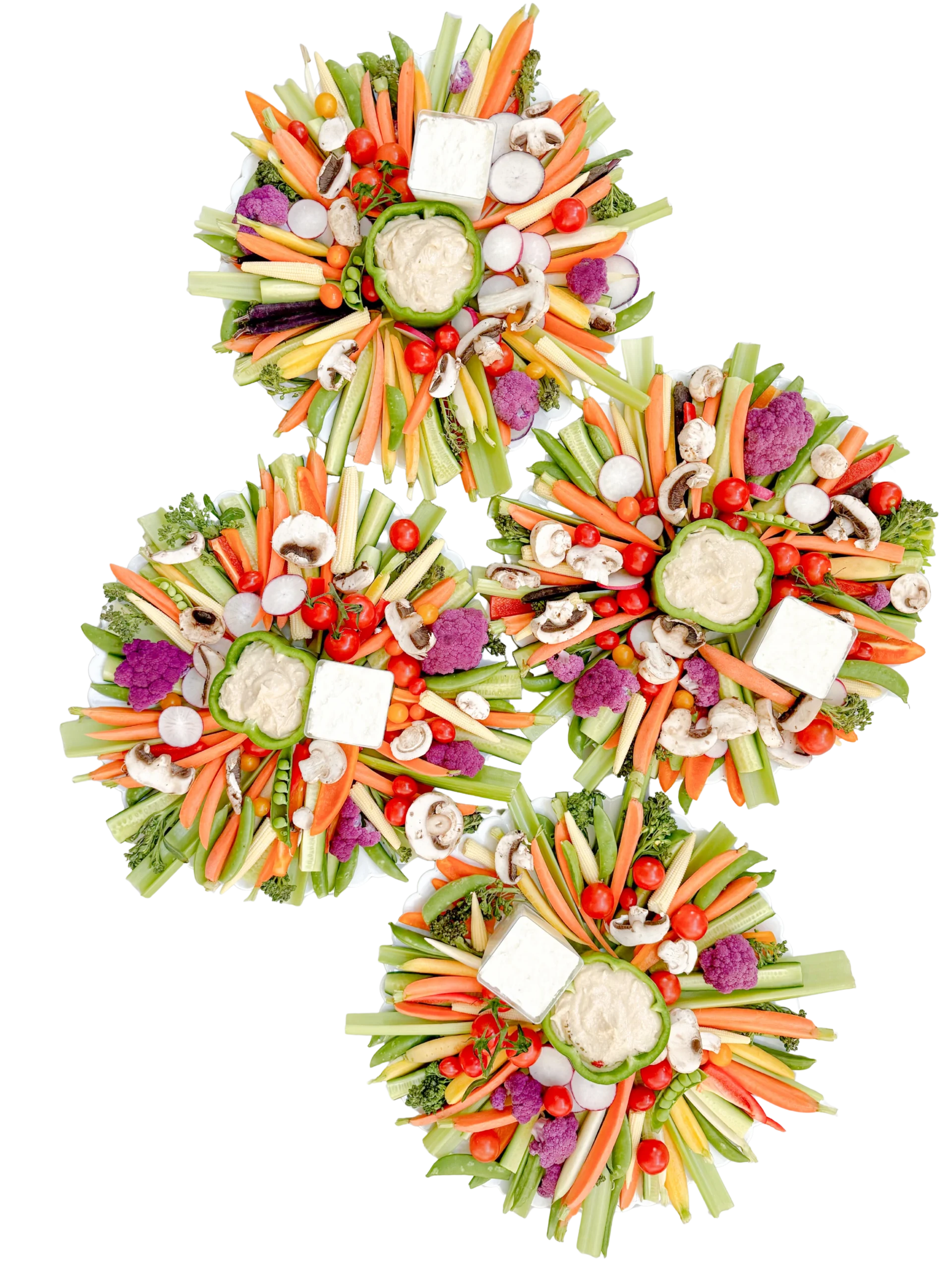 Four 12-inch crudités boards on bamboo leaf plate with fresh seasonal vegetables including carrots, cucumber, celery, peppers, snap peas, mushrooms, broccolini, radishes, cauliflower, and baby corn served with hummus, tzatziki, and roasted garlic dip — Fork and Flare catering Orange County.