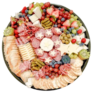 18-inch charcuterie party tray by Fork and Flare featuring brie, manchego, Boursin, cured meats, fruits, crackers, olives, and custom cheese lettering, perfect for themed events in Orange County, CA